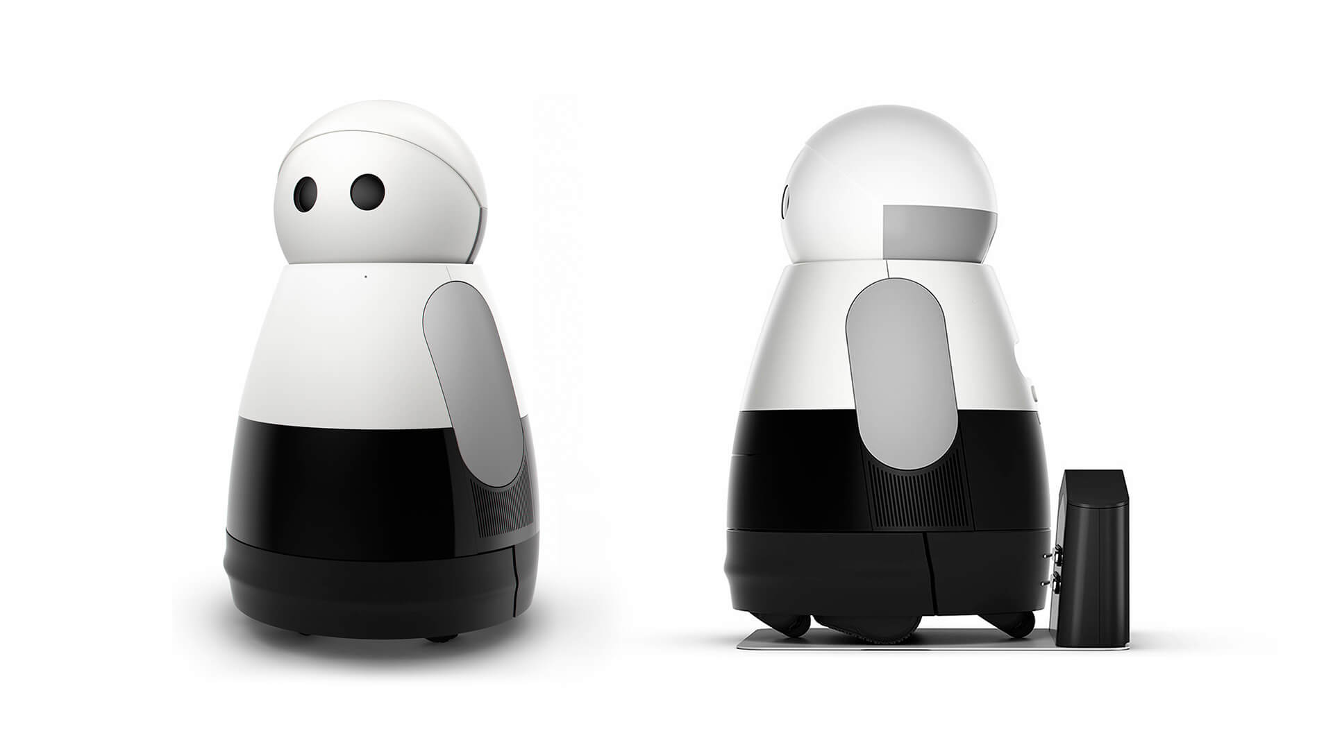 A front and side view of Kuri, a modern, anthropomorphic robot with a black and white color scheme, accompanied by a charging dock.