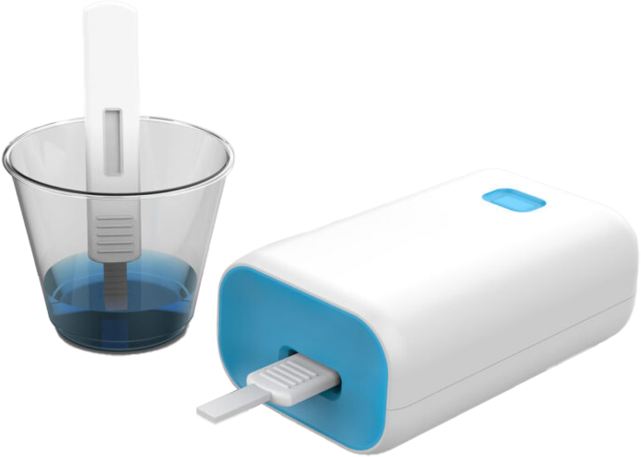 A portable white water flosser with a blue accent is placed next to a transparent cup containing water.